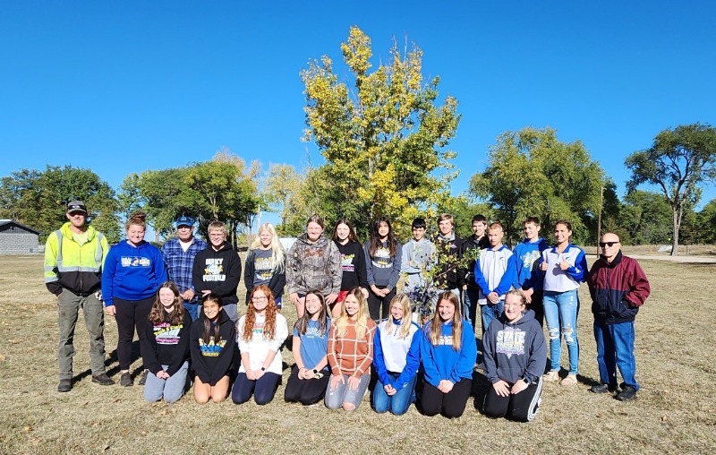 City of Atkinson maintenance and park crew members Charlie Griess and Gabrielle Wright, and Tree Board Members Scott Shane and Gary Lech Sr. stand with West Holt Public Schools freshman agriculture students near one of the trees the group planted at Atkin